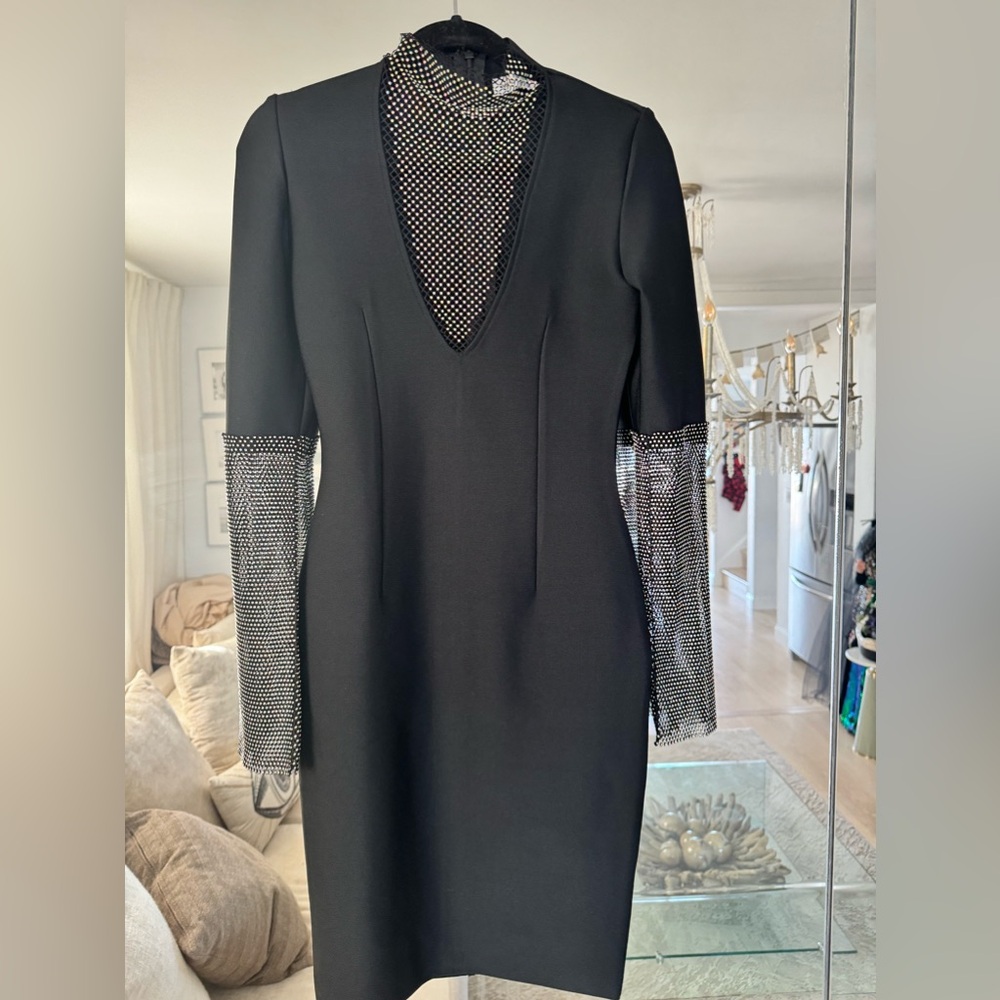 Black spandex, midi dress with rhinestone, sheer arms, and chest area